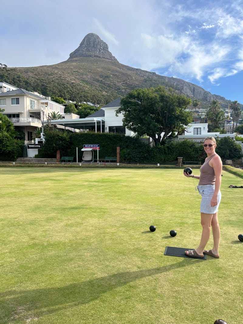 Natalie playing lawn bowls outdoors
